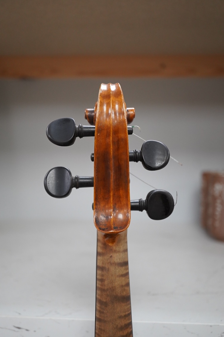 A late 19th century German violin in a Hill & Son oak case, with Hill canvas slip cover, together with an unbranded silver mounted bow, and another, ivory submission ref: 9HJU3B45 and ZC2E1GCP
